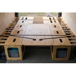 Camping box secured for transport in the trunk of the van