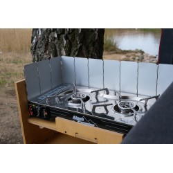 Camping gas stove with unfolded windscreen inside the kitchen drawer