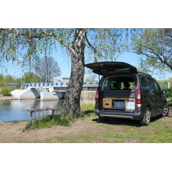 Compact KombiVan PREMIUM camping box folded in the car trunk, keeping the rear row of seats functional